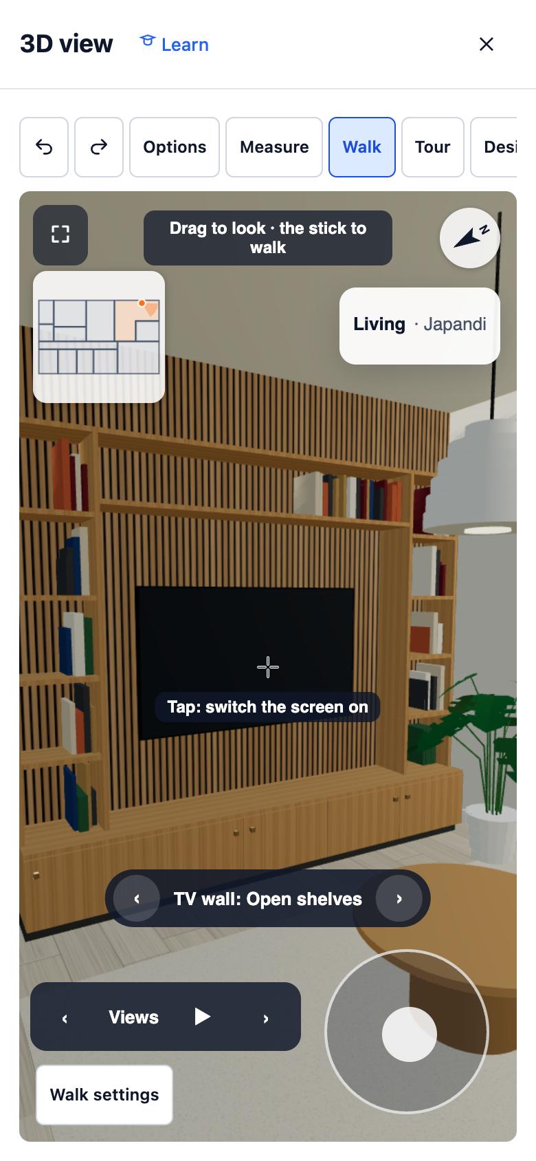 The living room view on a phone: the oak media wall fills the screen, with a small map in the corner, the room name, the TV wall option, a Views bar with play, and a stick to walk with.